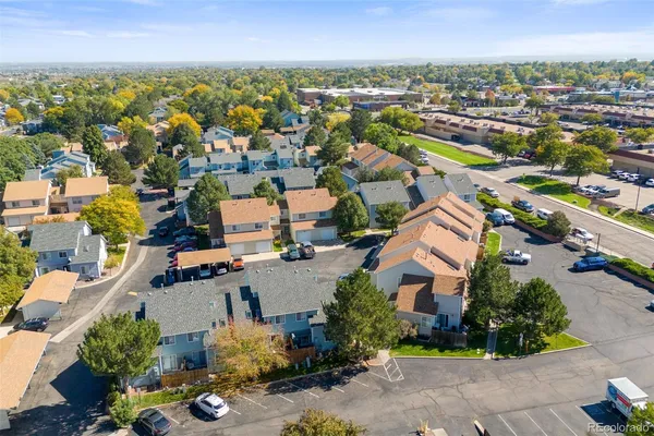 an aerial view of residential houses with outdoor space