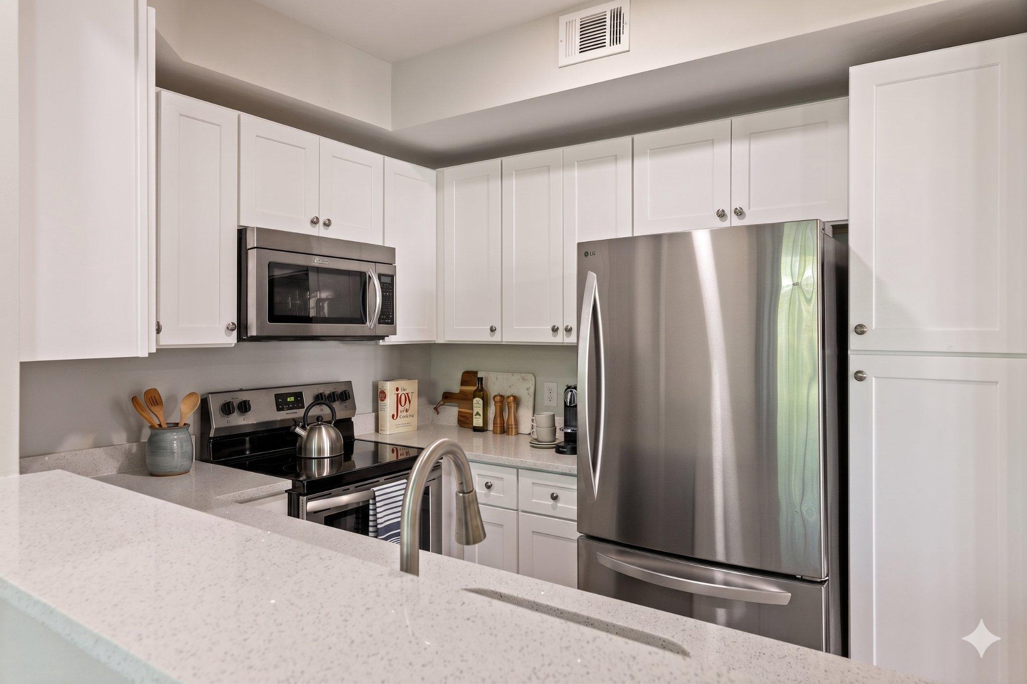 1318 Garden Wall Circle, Unit 213 Reston, VA 20194 - Photo 6 of 22 Sleek modern kitchen with elegance. AI staged