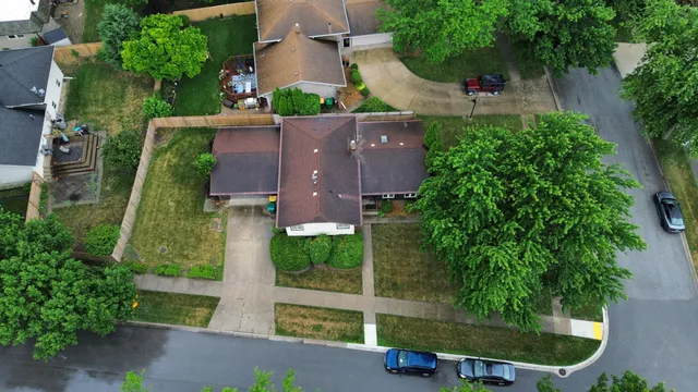 an aerial view of residential house with outdoor space and street view