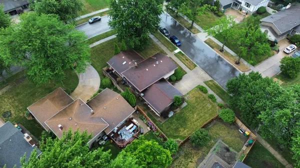 an aerial view of house with yard
