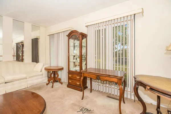 a bedroom with furniture and a window