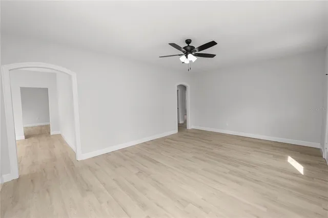 a view of an empty room and wooden floor