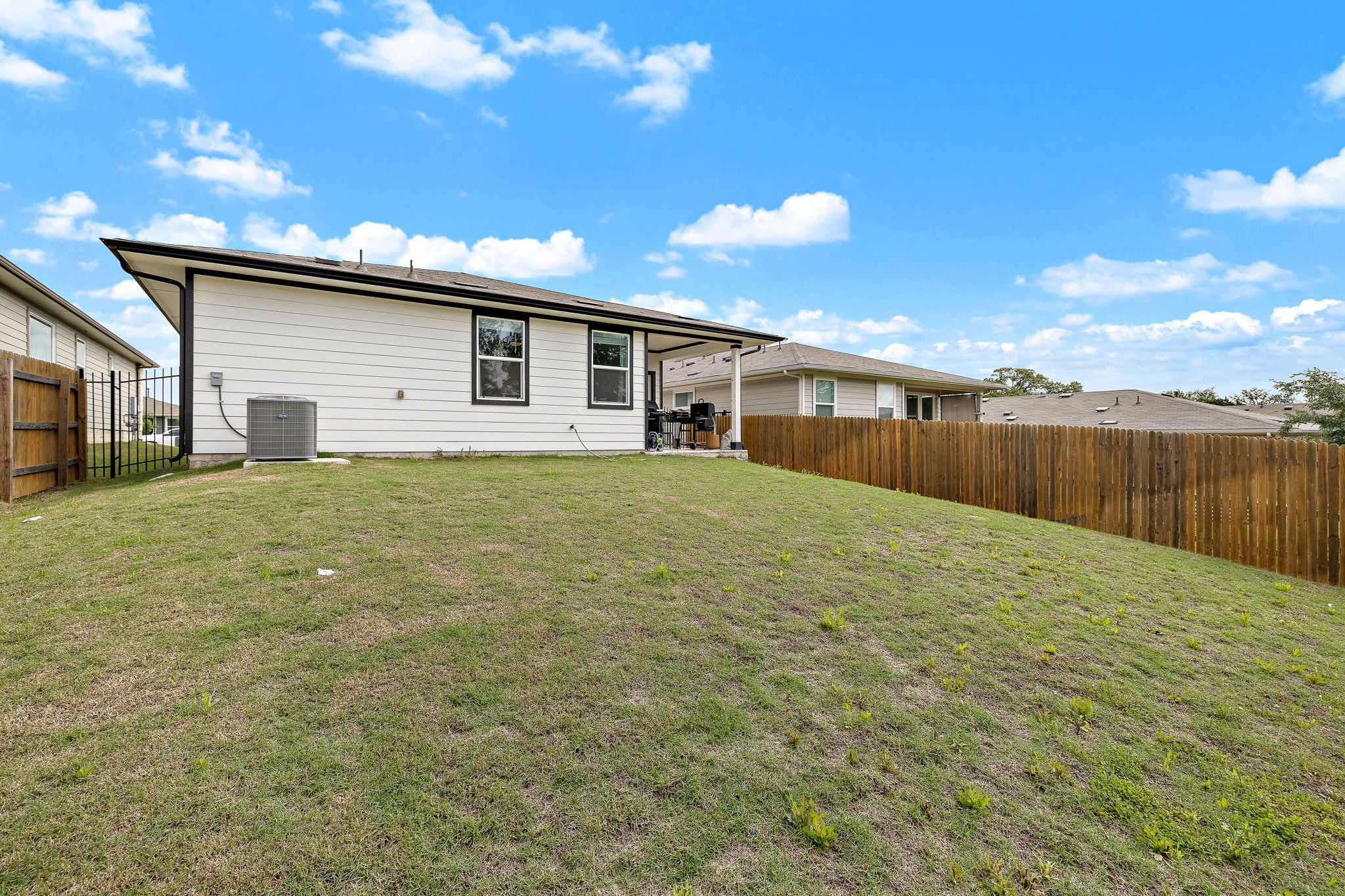 2313 Ranier Court Austin, TX 78754 - Photo 21 of 22 a view of a house with a yard