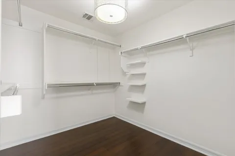 a view of an empty walk in closet