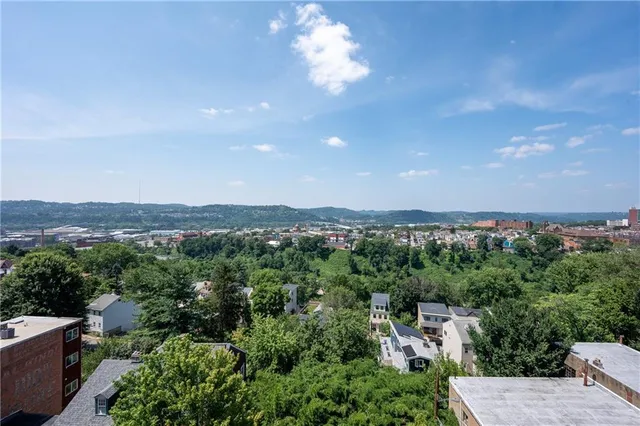 a aerial view of a house with a yard