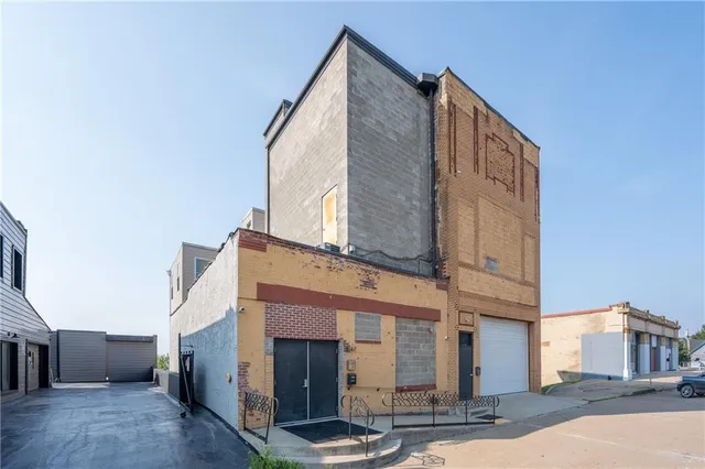 a view of roof deck with a barbeque and wooden floor