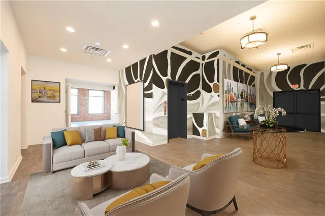 a living room with furniture and a chandelier