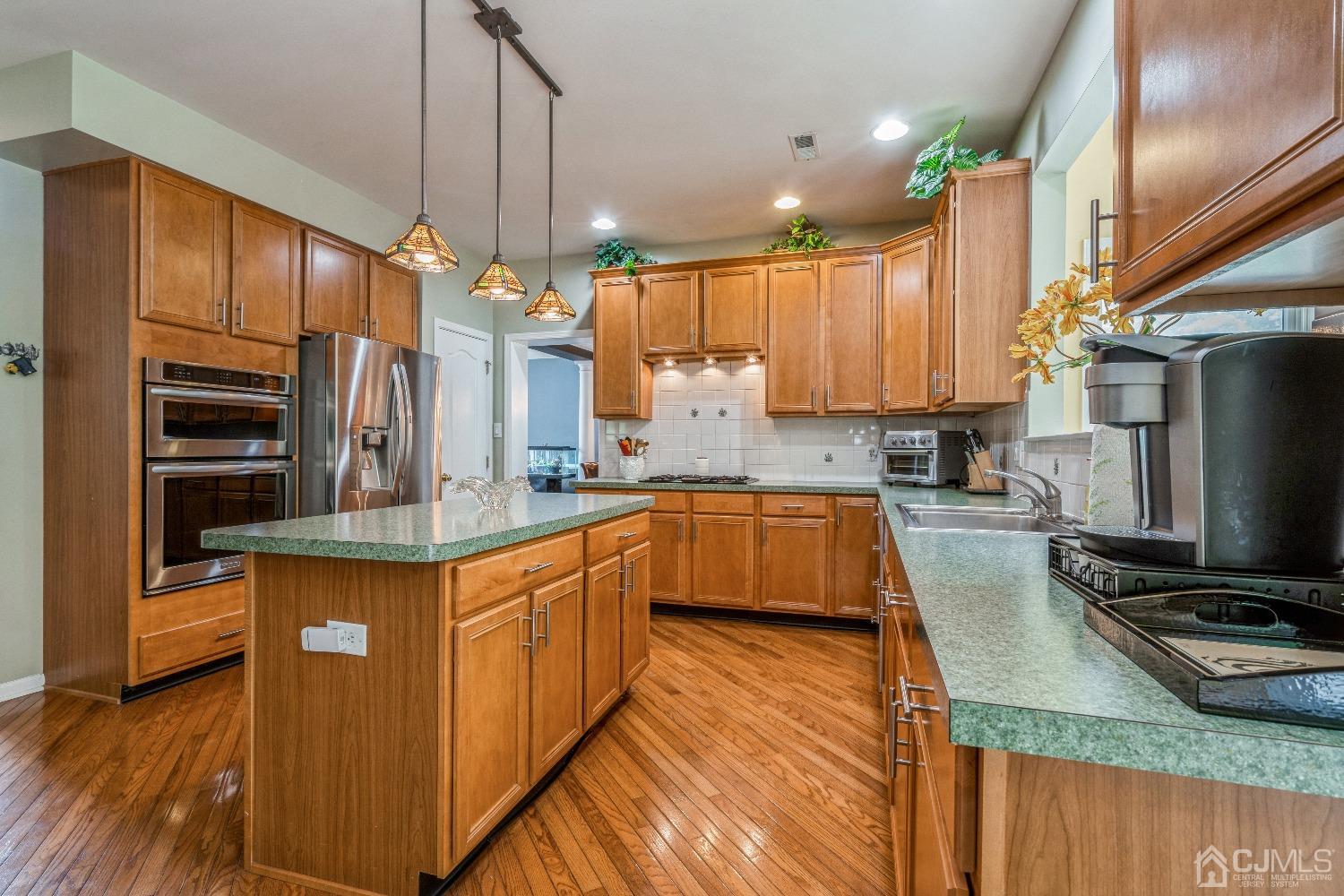 21 Rocky Hill Road Princeton, NJ 08540 - Photo 16 of 52 a kitchen with stainless steel appliances granite countertop a sink a stove and a refrigerator