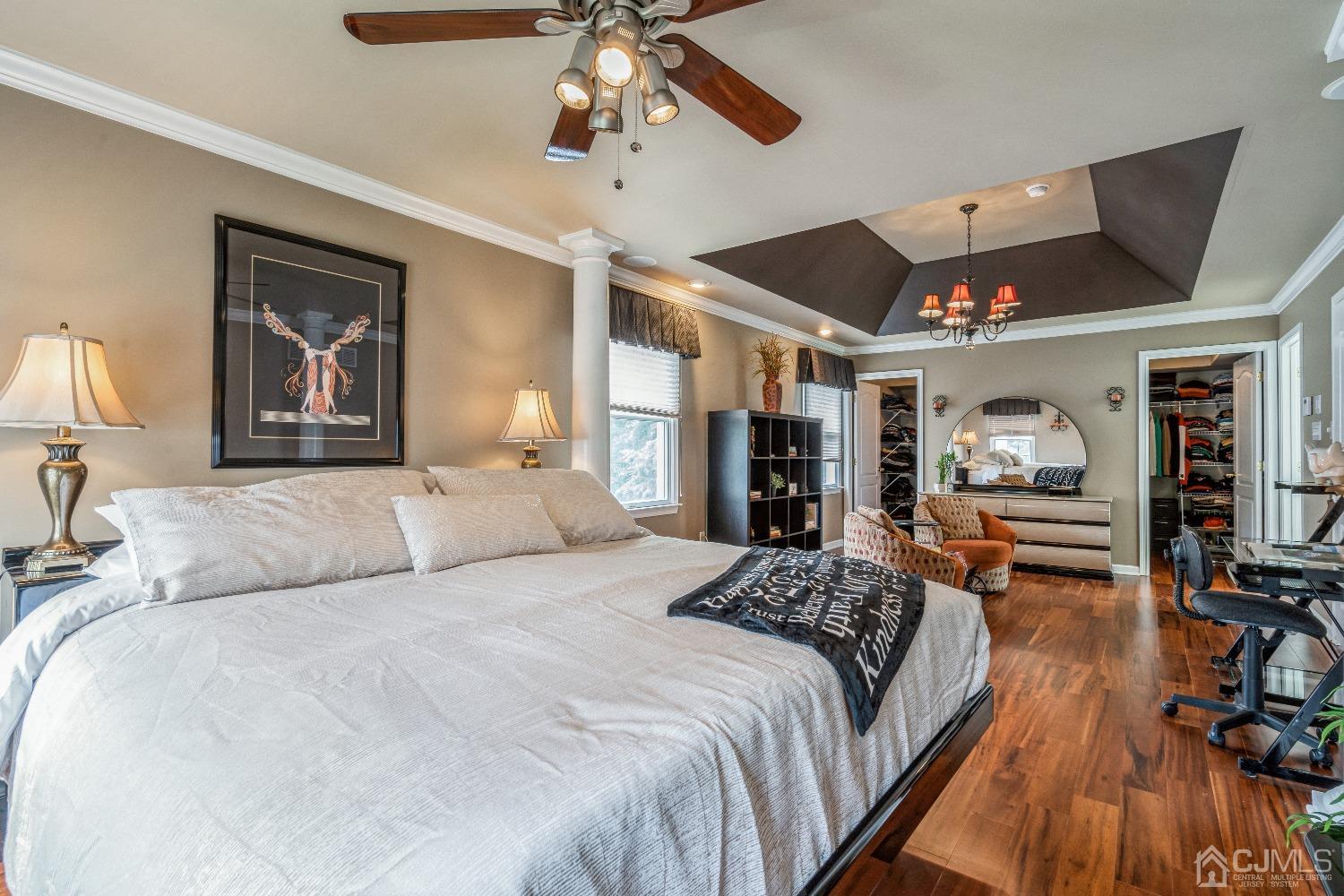 21 Rocky Hill Road Princeton, NJ 08540 - Photo 28 of 52 a bedroom with a large bed and a chandelier