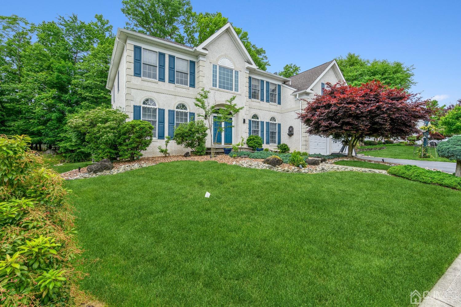 21 Rocky Hill Road Princeton, NJ 08540 - Photo 3 of 52 a front view of a house with a garden and plants