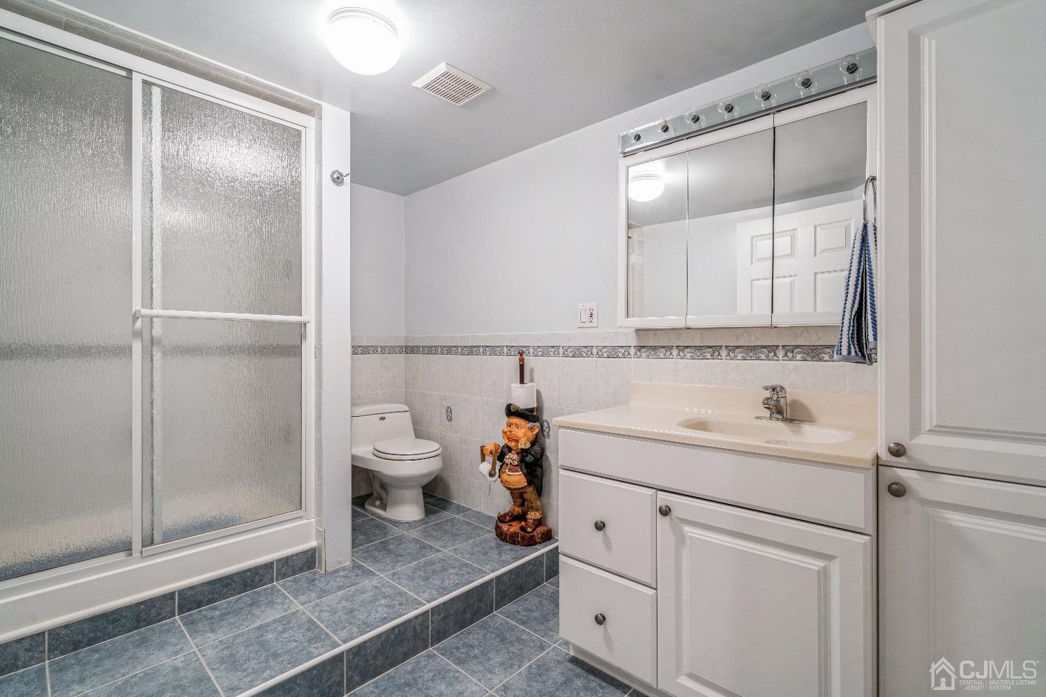 21 Rocky Hill Road Princeton, NJ 08540 - Photo 44 of 52 a bathroom with a sink a toilet and shower