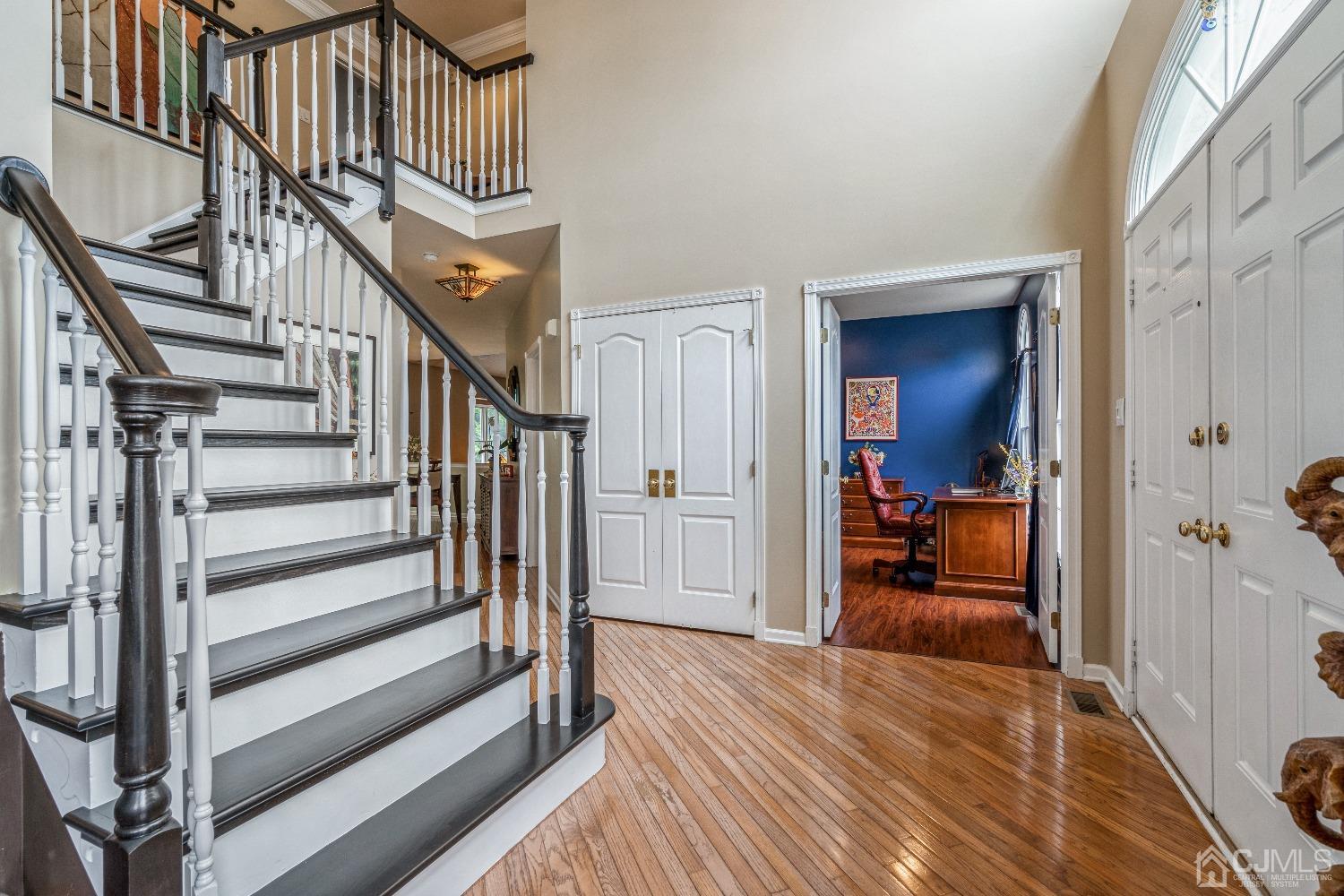 21 Rocky Hill Road Princeton, NJ 08540 - Photo 7 of 52 a view of a hallway to a livingroom with wooden floor and furniture