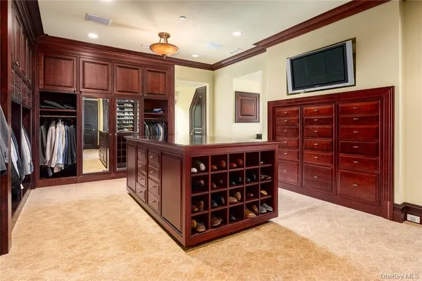 a bedroom with furniture and a large window