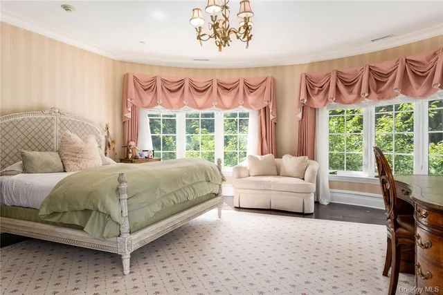 a bedroom with large bed and window