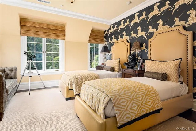 a bedroom with a bed and window