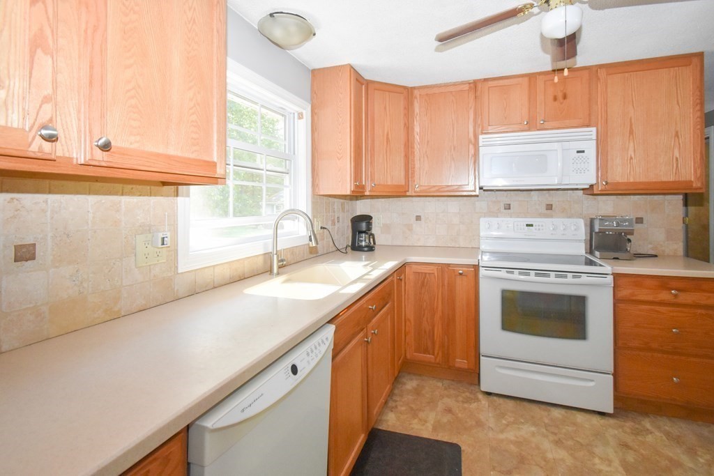 19 Rider Road Westfield, MA 01085 - Photo 8 of 20 a kitchen with a sink stove top oven and cabinets