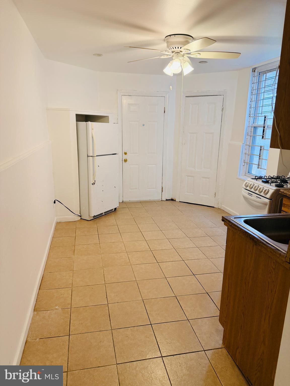 2260 North 15th Street Philadelphia, PA 19132 - Photo 2 of 12 a view of a kitchen with cabinet and a fireplace