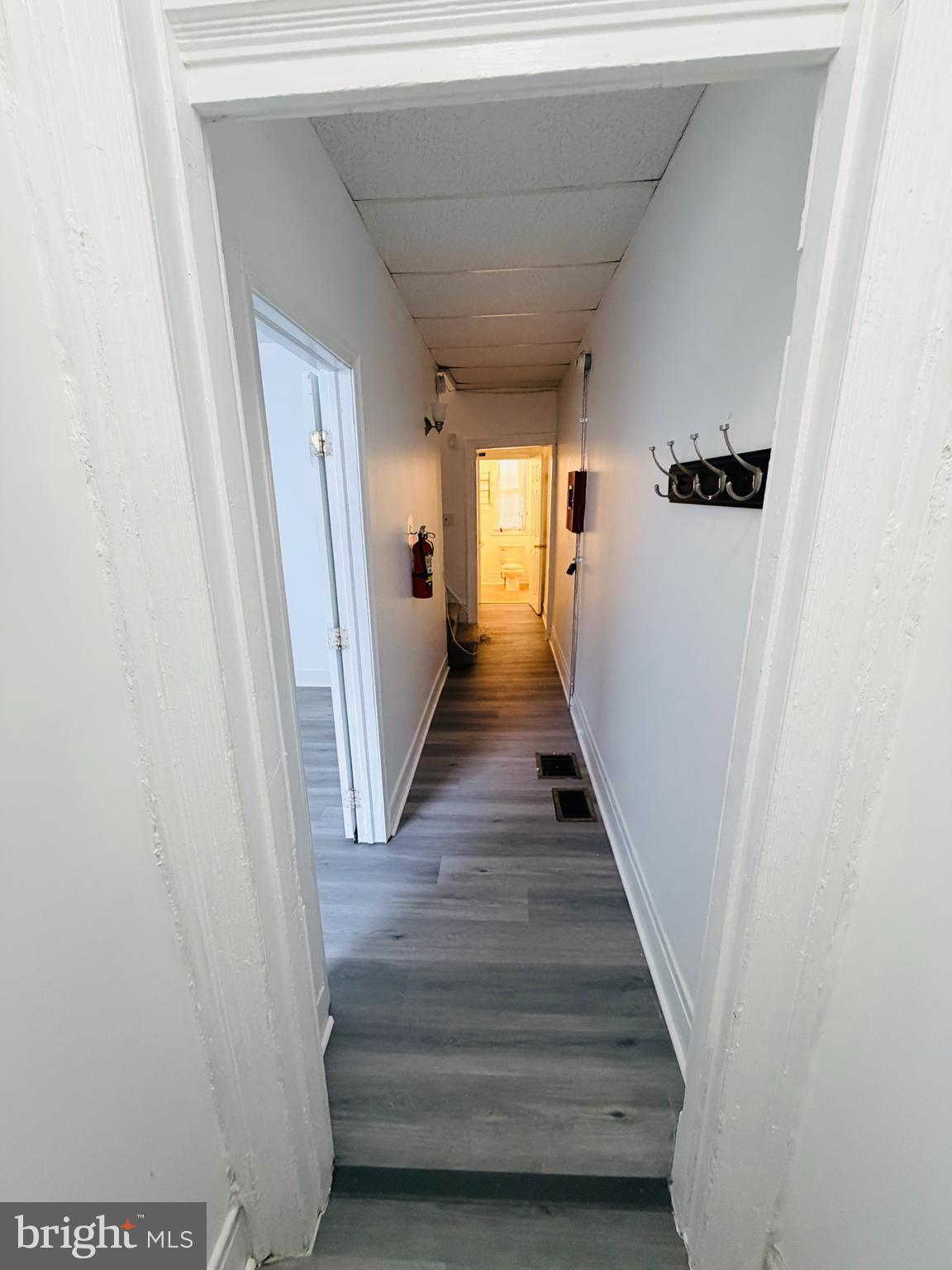 2260 North 15th Street Philadelphia, PA 19132 - Photo 6 of 12 a view of a hallway with wooden floor and staircase