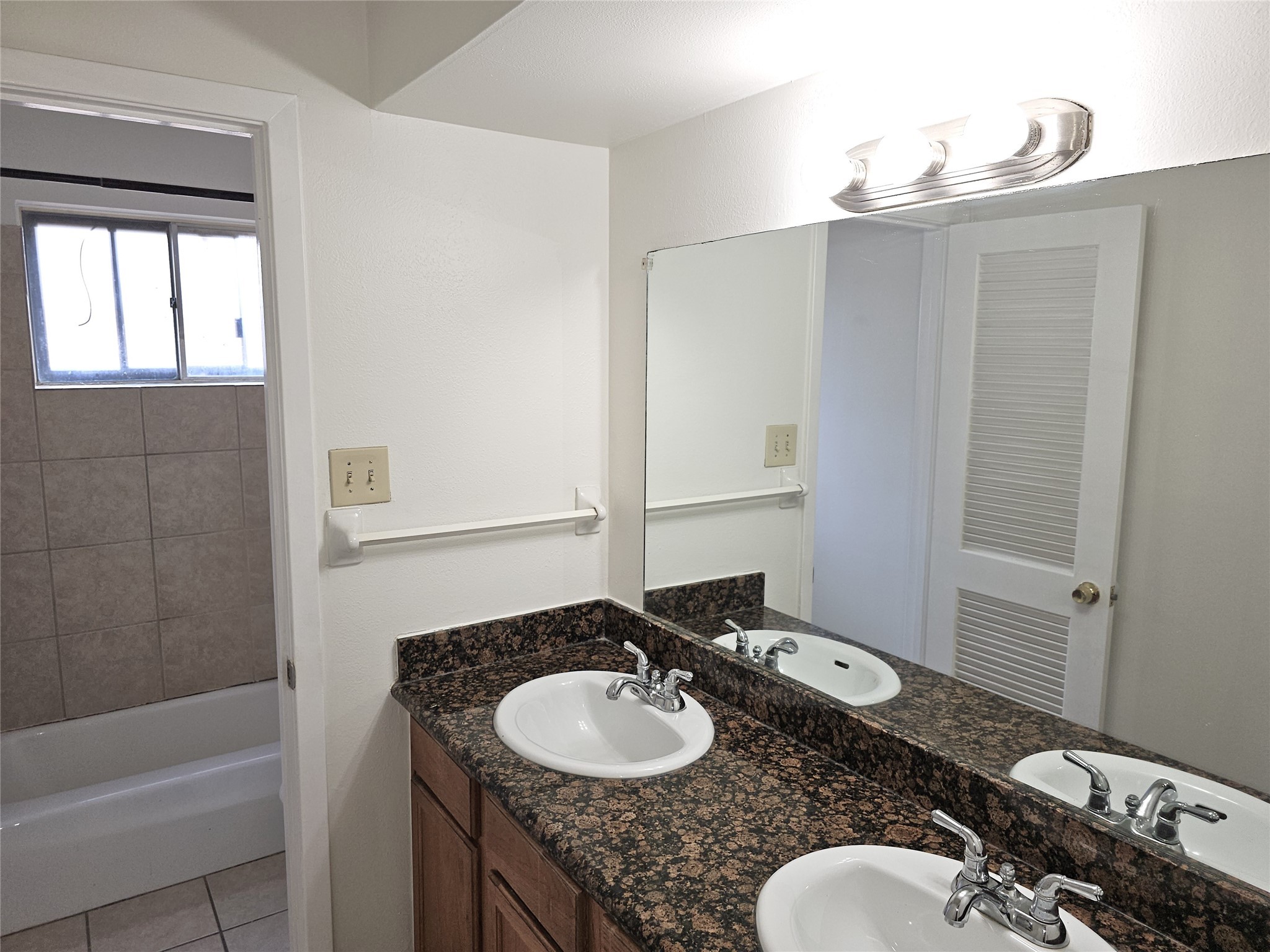 11427 Kirkmeadow Drive Houston, TX 77089 - Photo 19 of 24 a bathroom with a granite countertop sink and a mirror