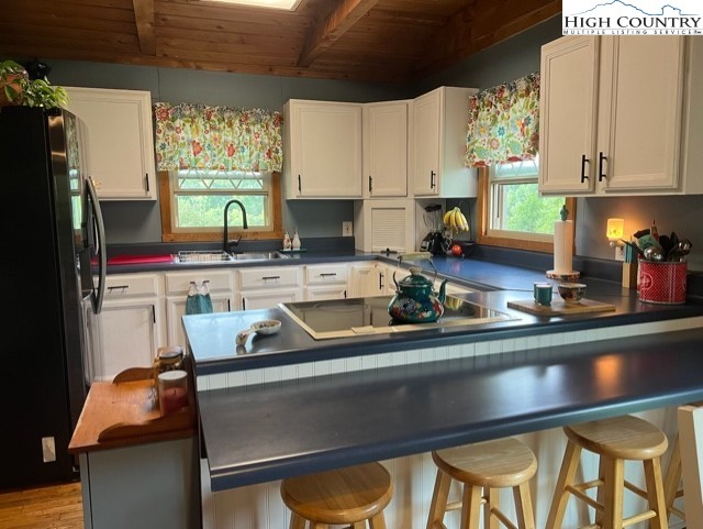 2232 Greer Town Road Lansing, NC 28643 - Photo 6 of 28 a kitchen with a sink cabinets and a window