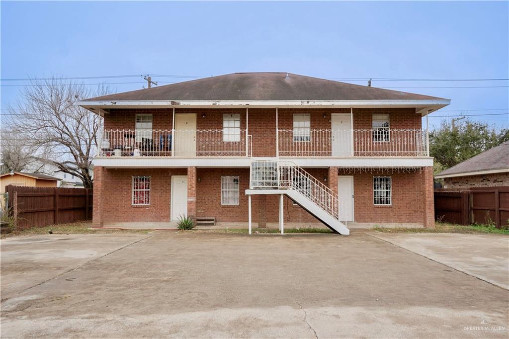 View of front facade featuring a balcony and a patio area