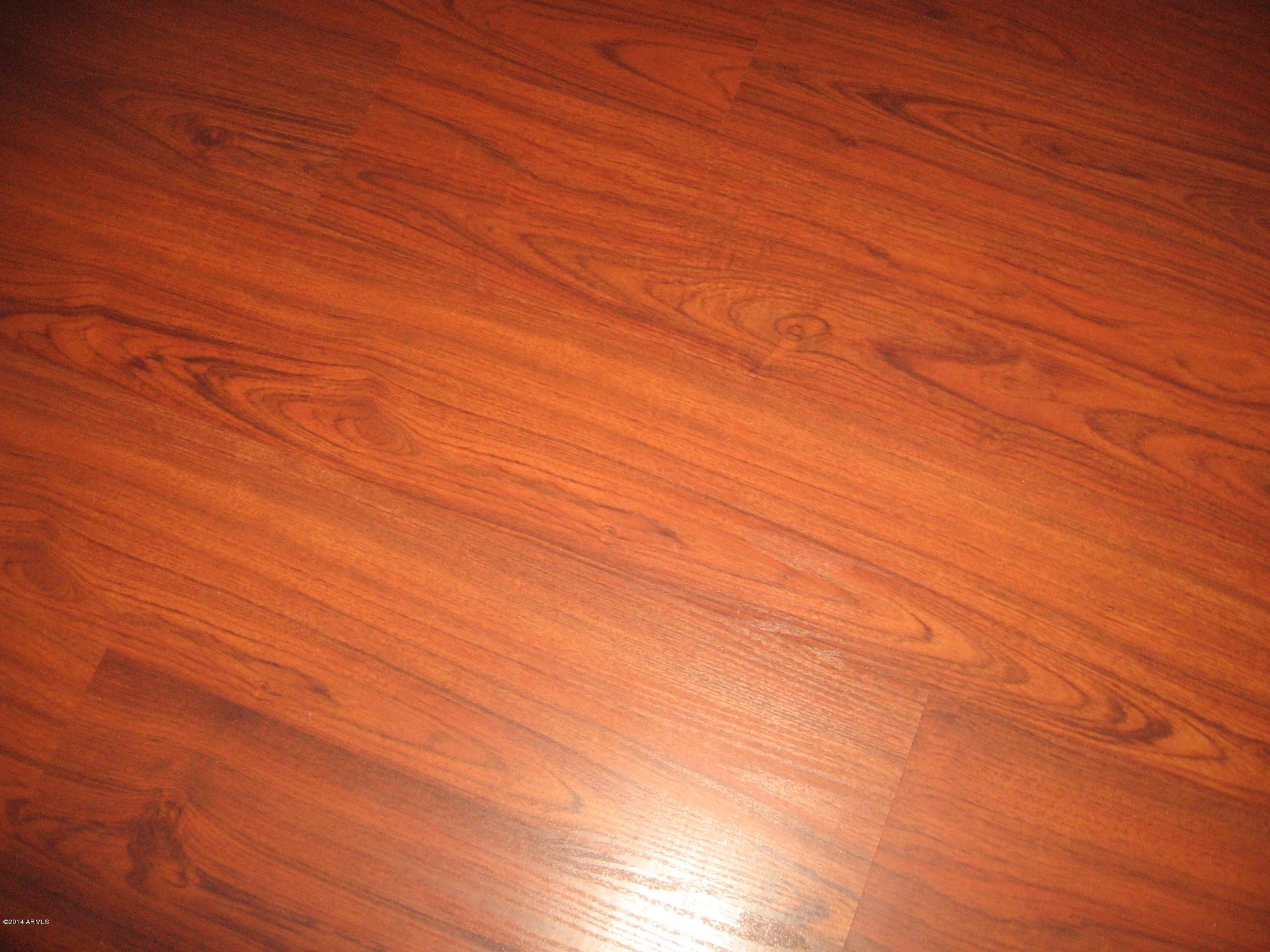 18022 West Hatcher Road Waddell, AZ 85355 - Photo 15 of 38 a view of empty room with wooden floor