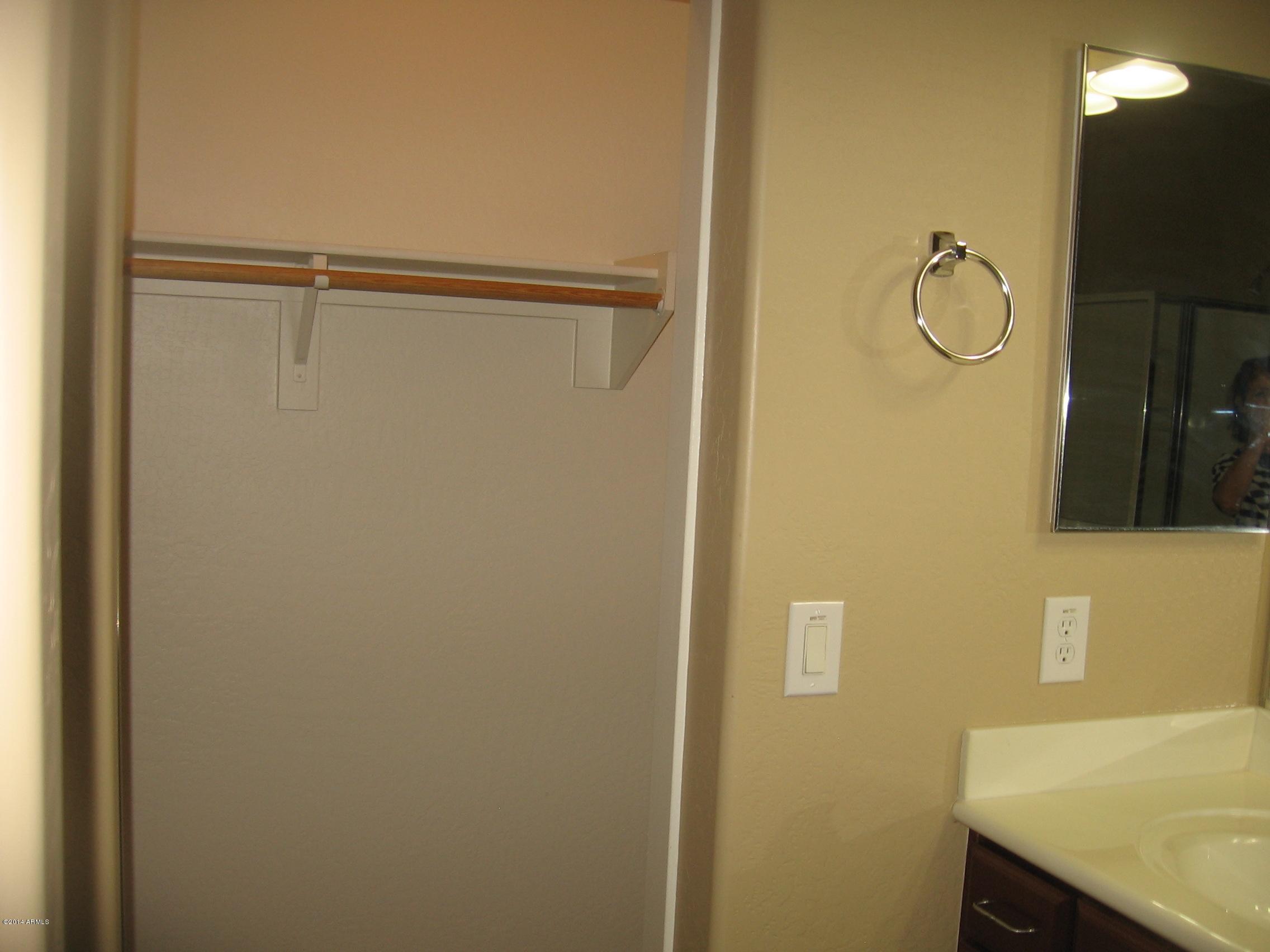 18022 West Hatcher Road Waddell, AZ 85355 - Photo 19 of 38 a bathroom with a shower and a sink