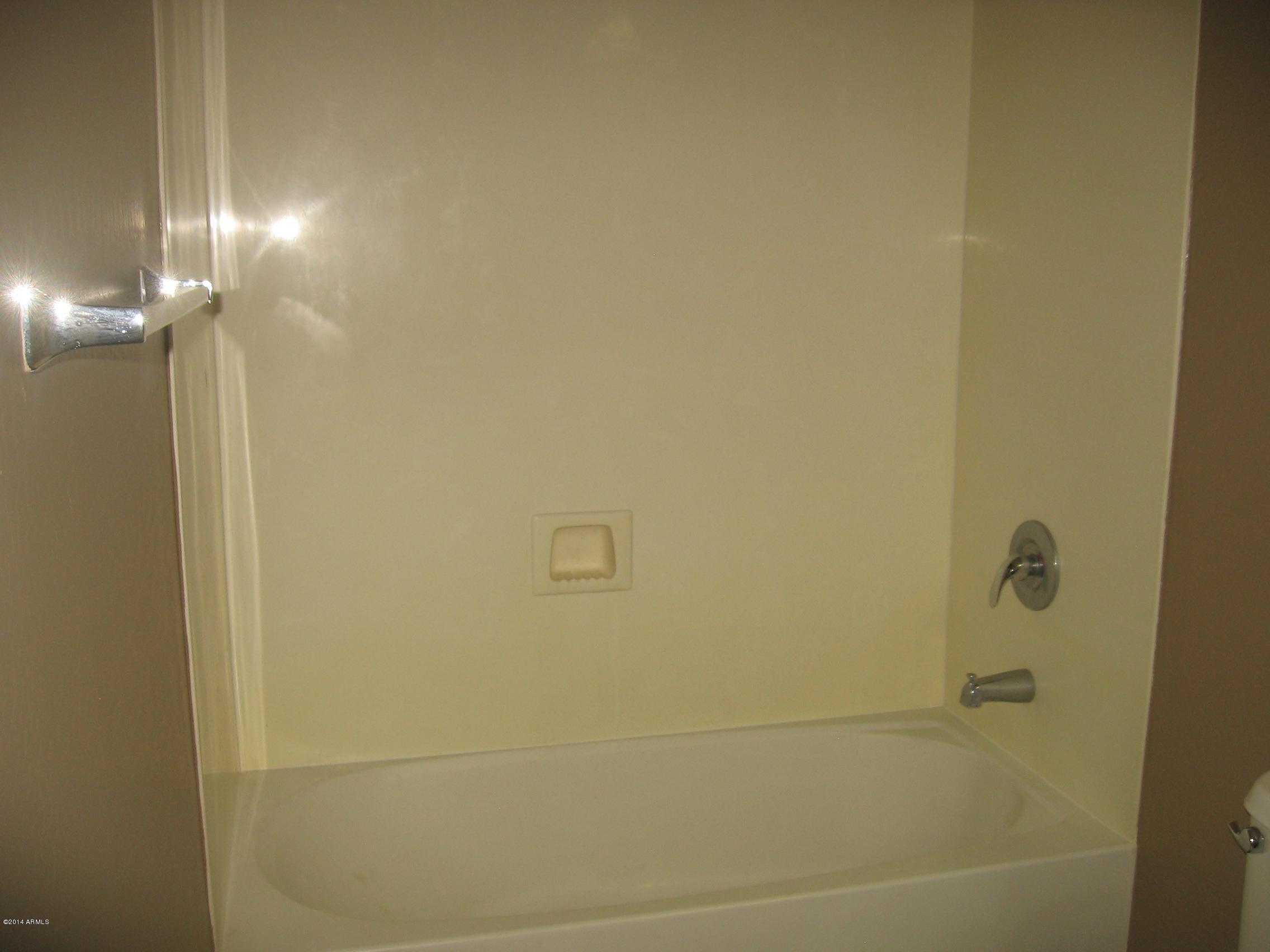 18022 West Hatcher Road Waddell, AZ 85355 - Photo 29 of 38 a bathroom with a shower