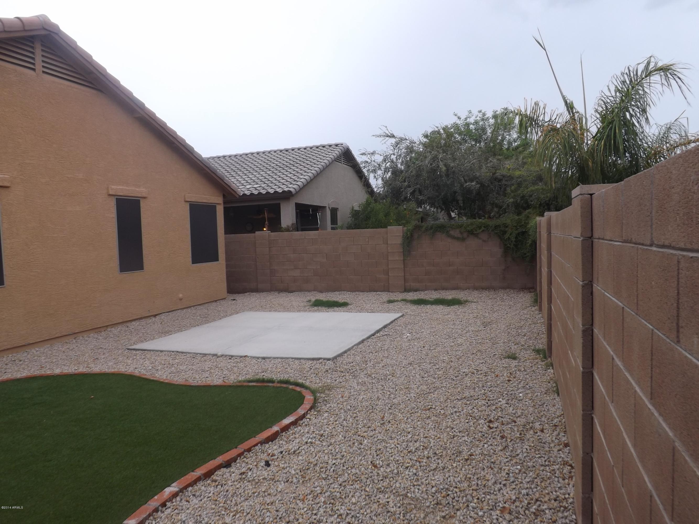 18022 West Hatcher Road Waddell, AZ 85355 - Photo 33 of 38 a house view with a backyard space