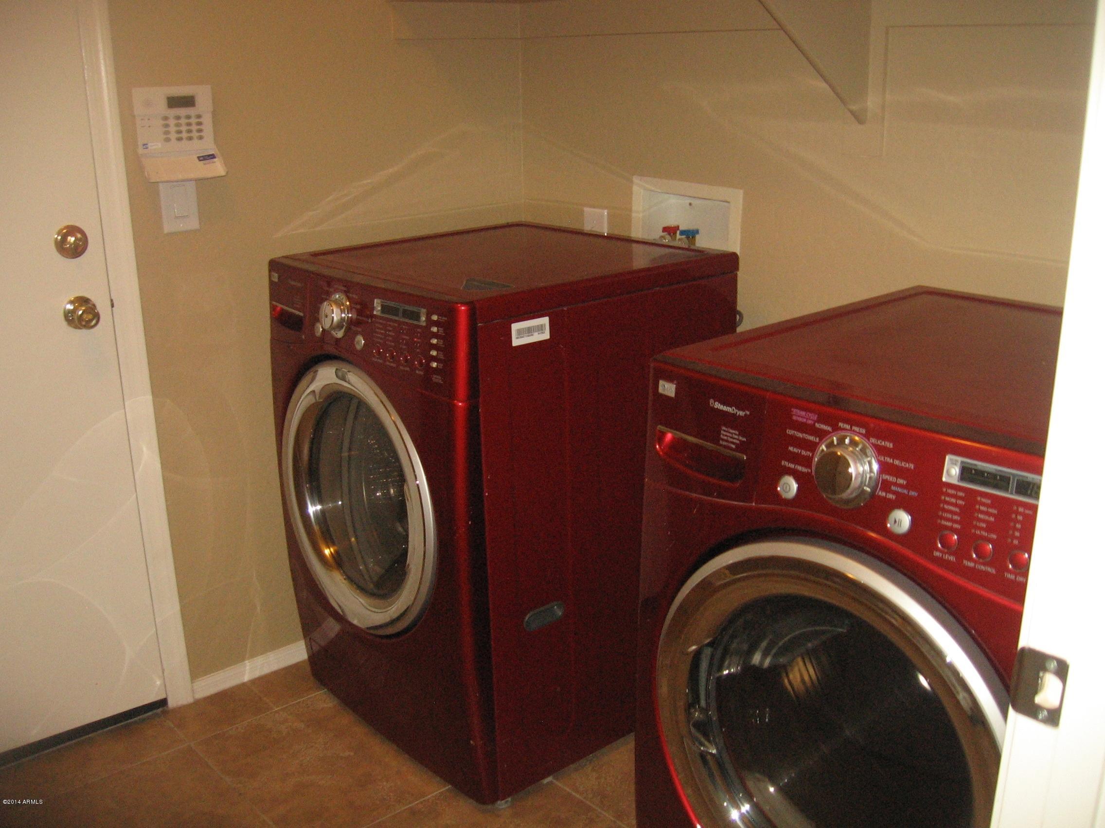 18022 West Hatcher Road Waddell, AZ 85355 - Photo 37 of 38 a utility room with dryer and washer