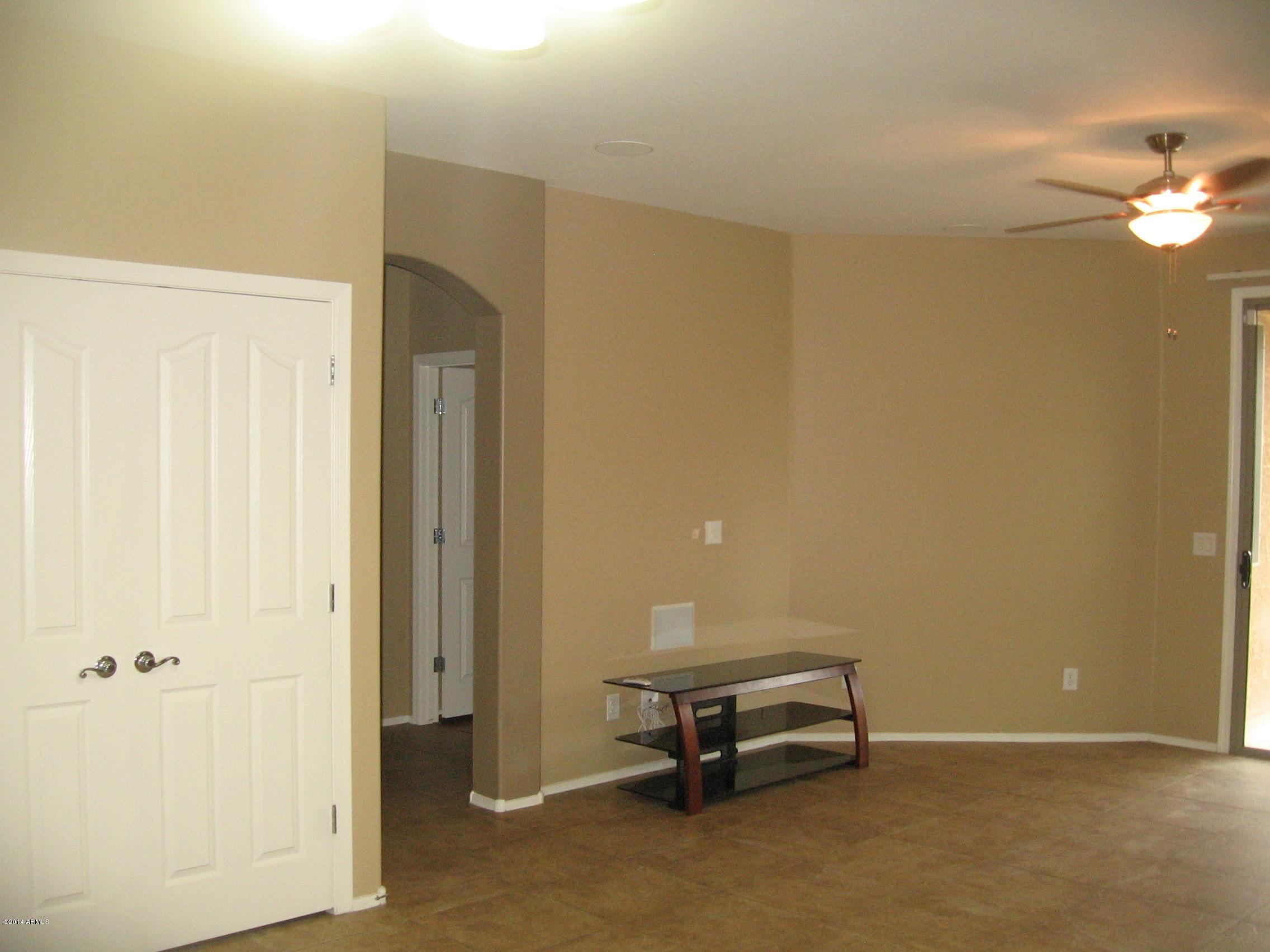 18022 West Hatcher Road Waddell, AZ 85355 - Photo 8 of 38 a view of a room with a bench