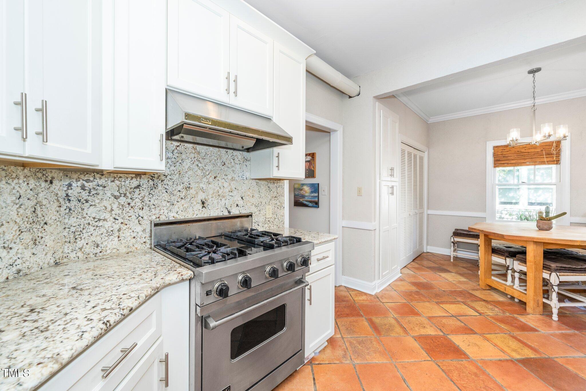 1712 Briarforest Place Raleigh, NC 27615 - Photo 6 of 55 The center of the chef's kitchen is the Viking range.