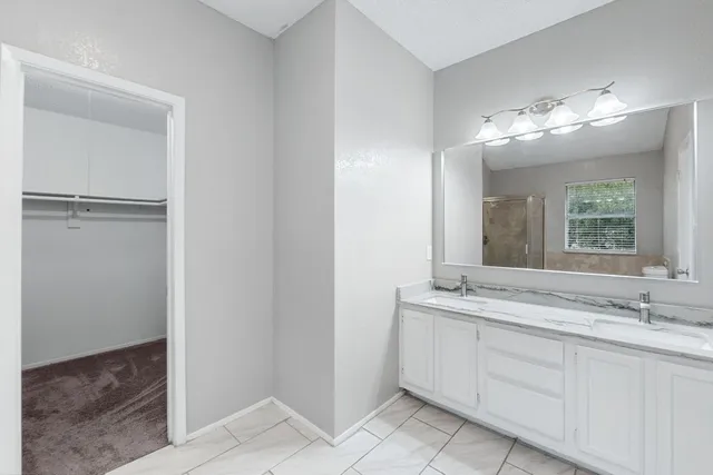 a bathroom with a sink and mirror