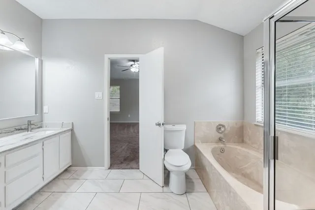 a bathroom with a bathtub toilet and sink