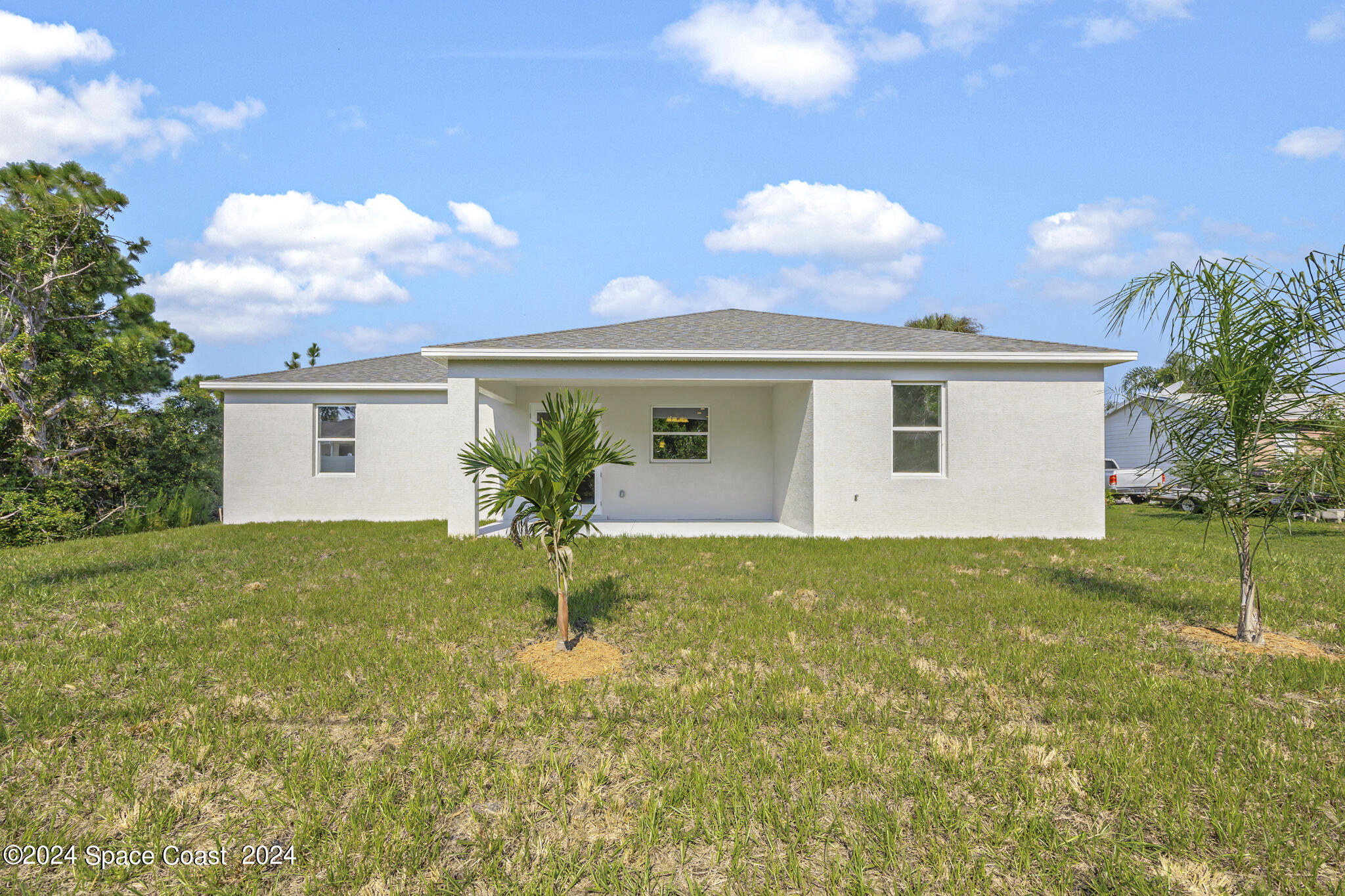 1368 Rabbit Street Southeast Palm Bay, FL 32909 - Photo 4 of 31 a view of a house with backyard and a garden