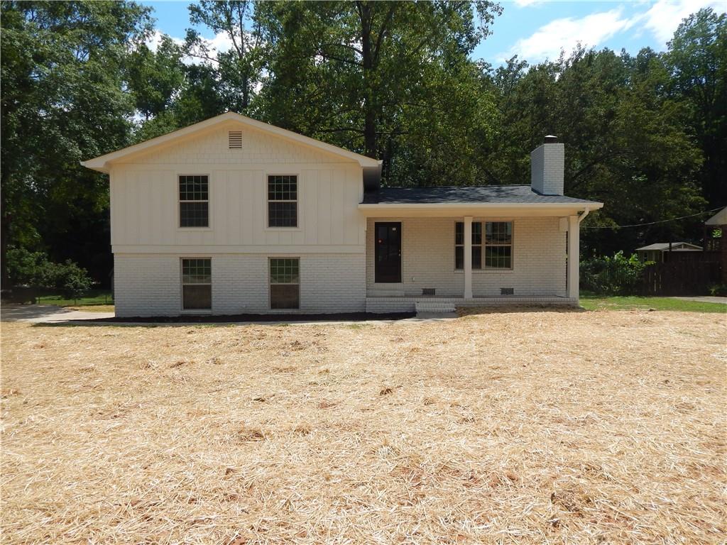 958 Pine Valley Road Winder, GA 30680 - Photo 1 of 1 a front of a house with a yard