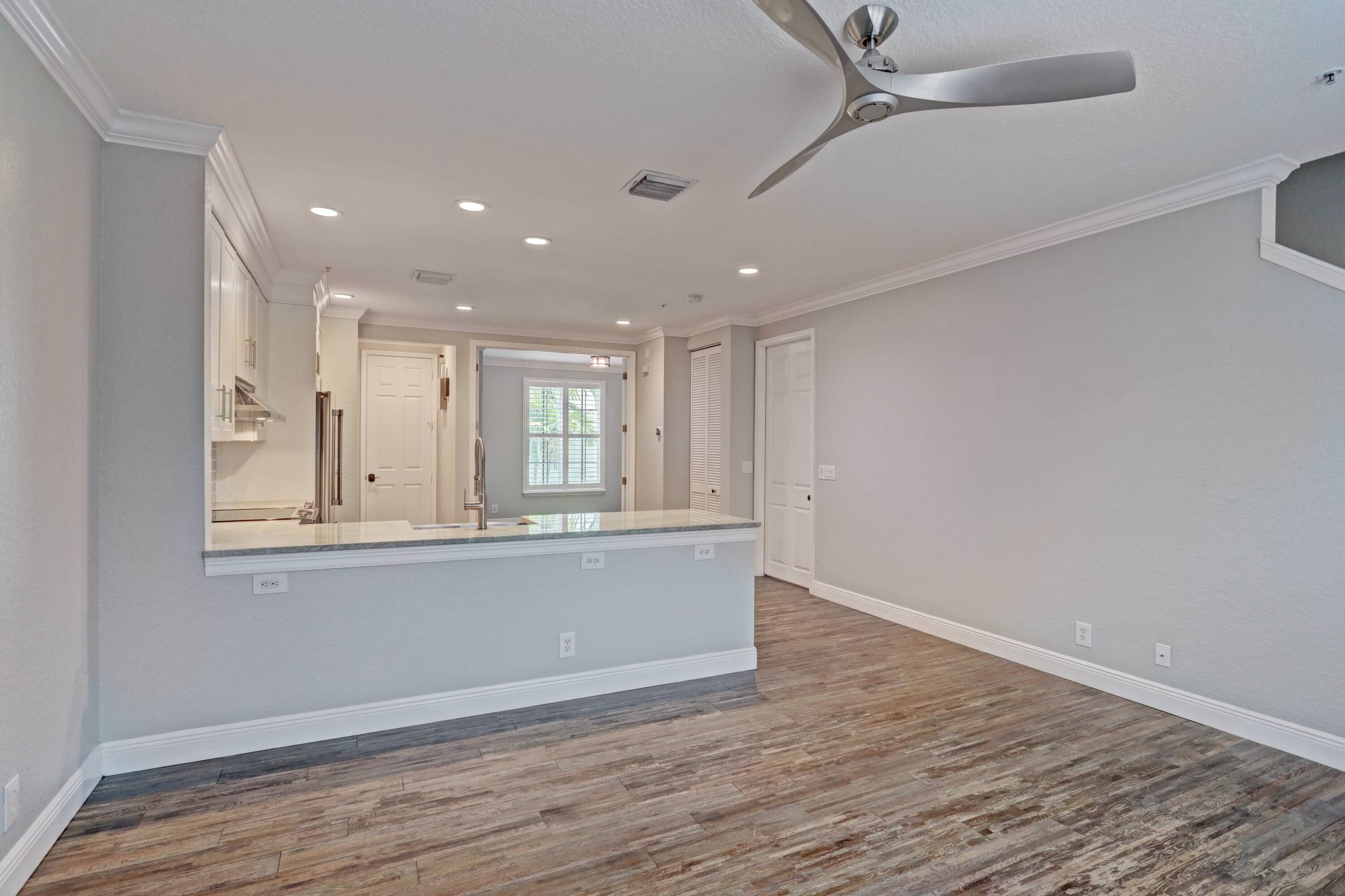 161 Apalachee Lane Jupiter, FL 33458 - Photo 12 of 32 DINING TO KITCHEN