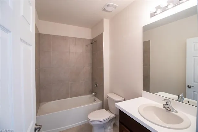 a bathroom with a sink a toilet and a bathtub