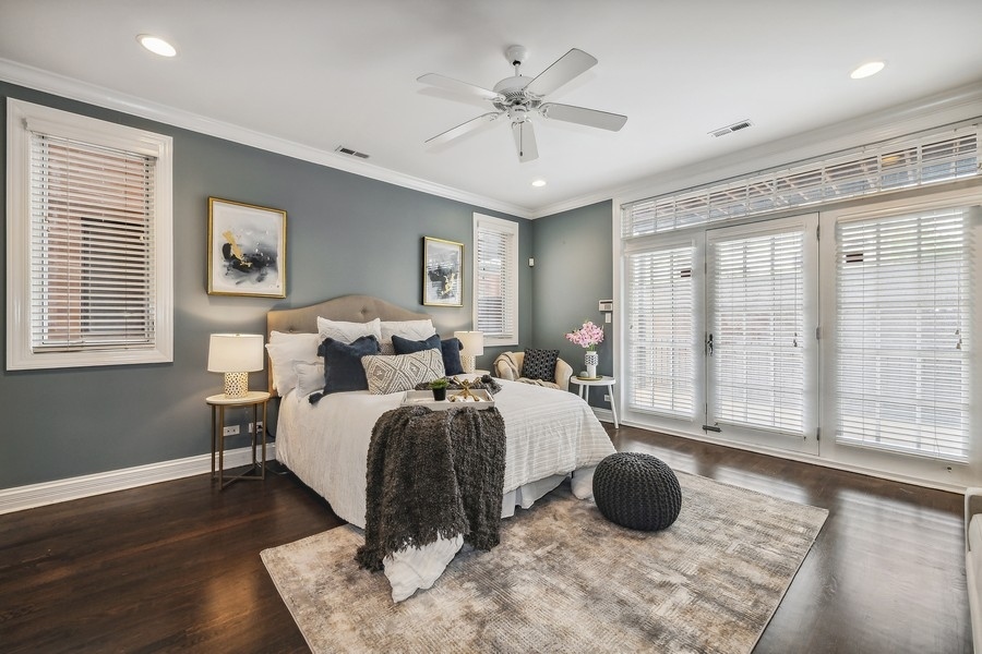 1359 North Mohawk Street, Unit 2 Chicago, IL 60610 - Photo 12 of 23 a bed room with a bed and a large window