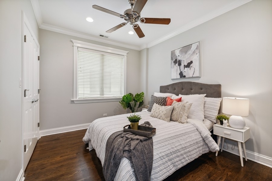 1359 North Mohawk Street, Unit 2 Chicago, IL 60610 - Photo 16 of 23 a bedroom with a bed and wooden floor