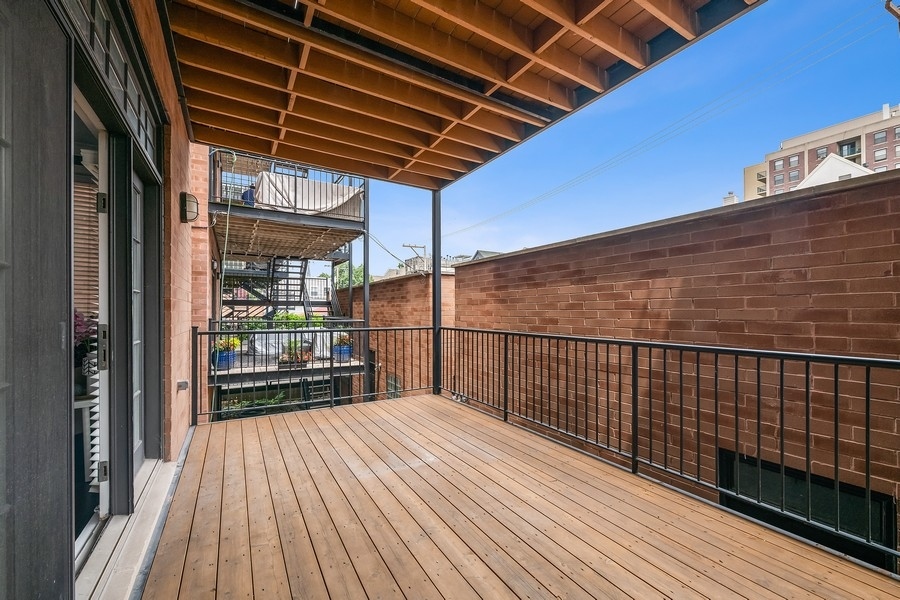 1359 North Mohawk Street, Unit 2 Chicago, IL 60610 - Photo 21 of 23 a view of balcony with wooden floor