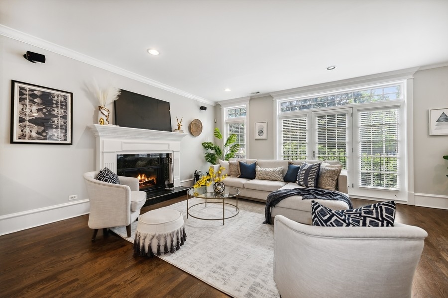 1359 North Mohawk Street, Unit 2 Chicago, IL 60610 - Photo 10 of 23 a living room with furniture a large window and a fireplace