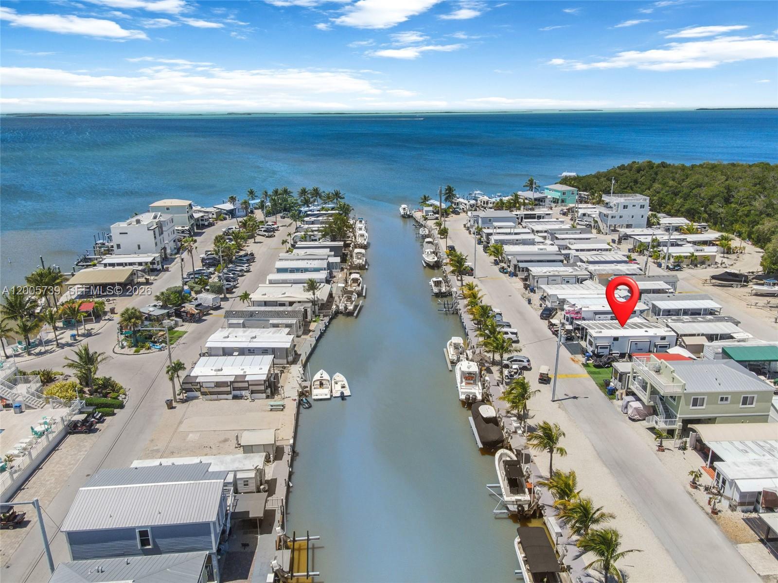 325 Calusa Street, Unit 312 Key Largo, FL 33037 - Photo 2 of 21 an aerial view of residential building with ocean view