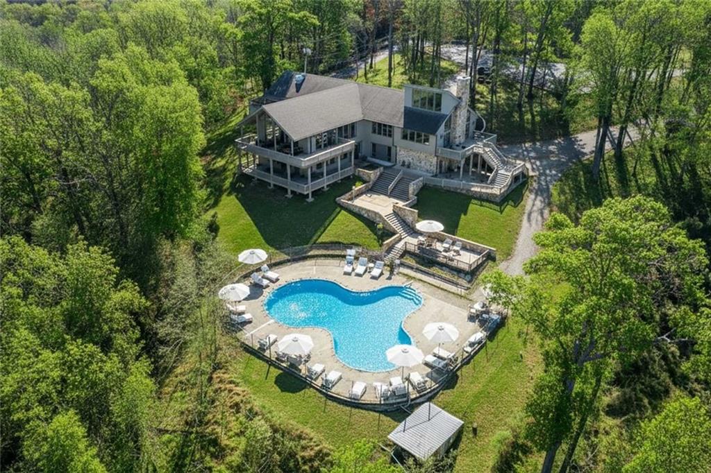 56 Buckeye Trail Jasper, GA 30143 - Photo 7 of 34 an aerial view of a house with backyard swimming pool and outdoor seating