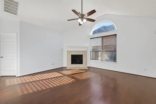 a view of a big room with a ceiling fan