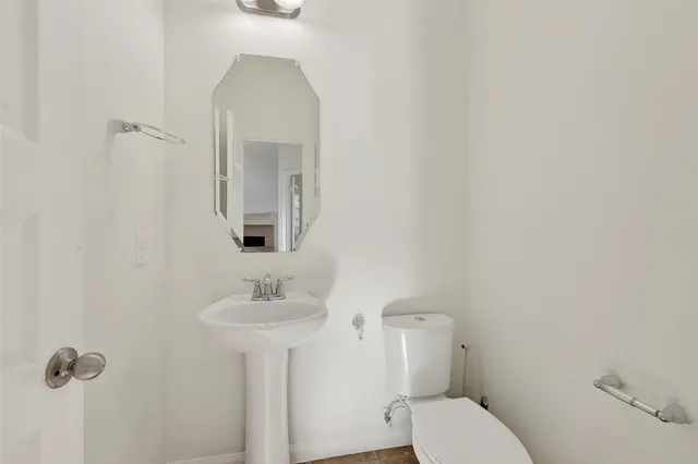 an empty room with a window and a ceiling fan