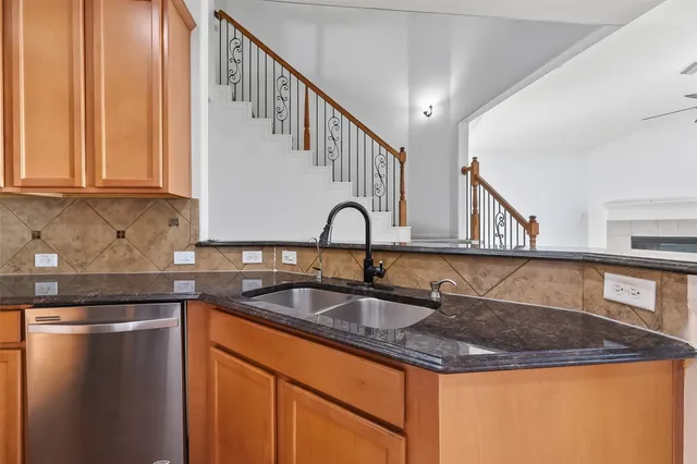 a view of a house with a yard and sitting area
