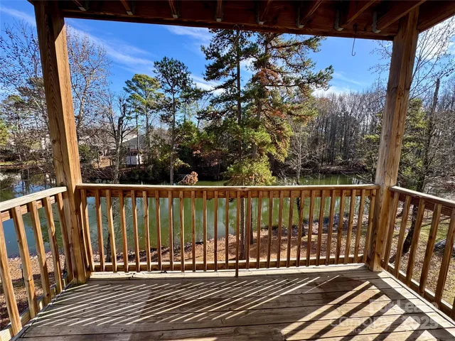 a view of balcony with wooden floor