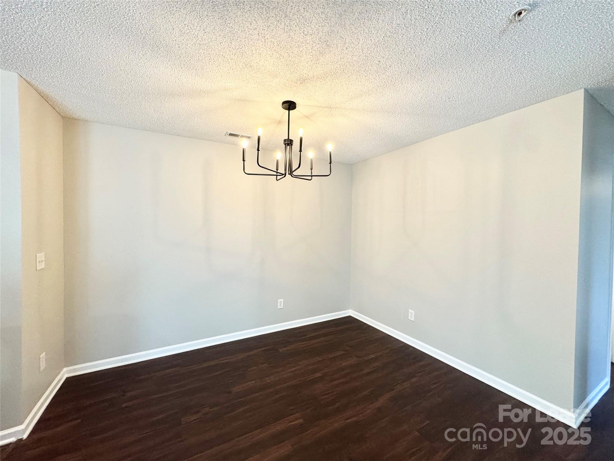 327 Flint Hill Road, Unit 203 Fort Mill, SC 29715 - Photo 7 of 18 a view of empty room with wooden floor