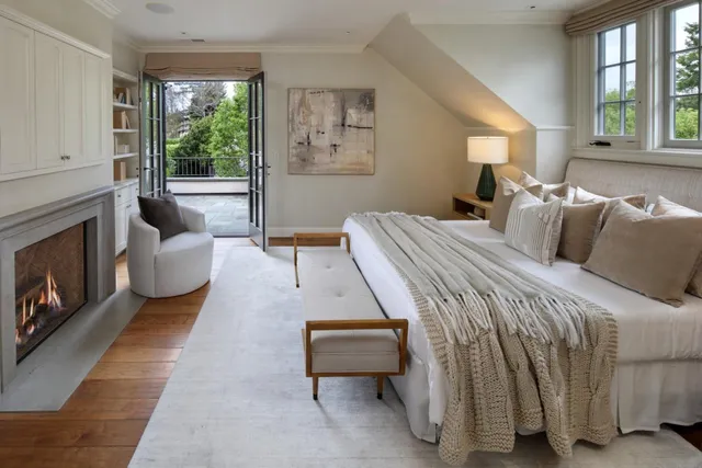 a bedroom with a bed and a couch